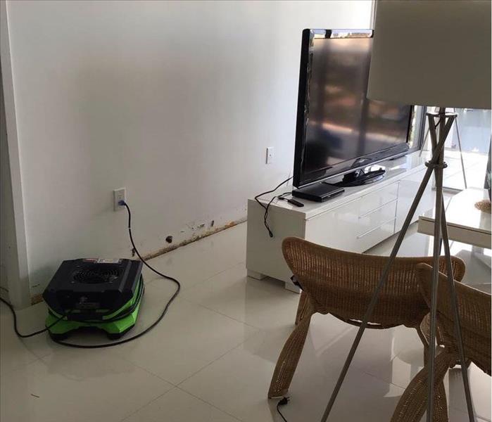 Hallandale Home with Water Damage in hallway and servpro equipment